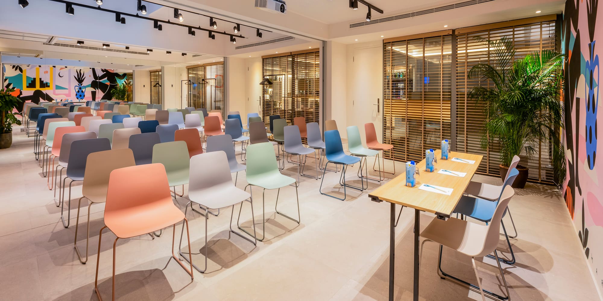 a room with many chairs and tables