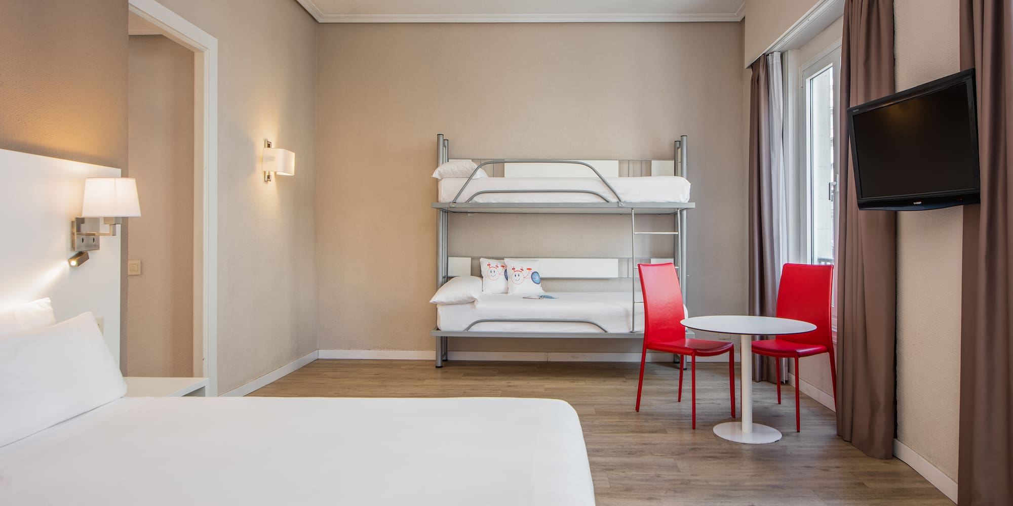 a room with a bunk bed and a table