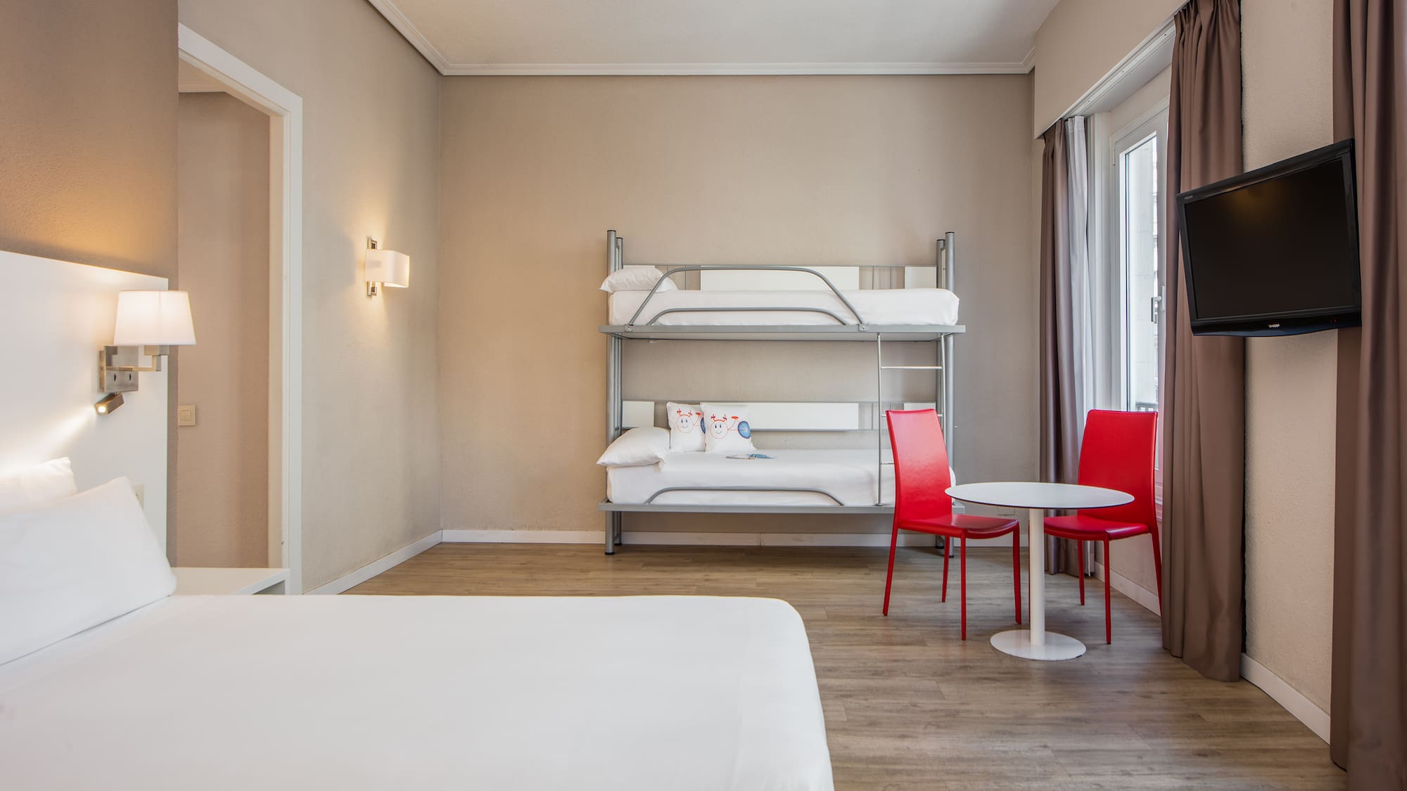 a room with a bunk bed and a table