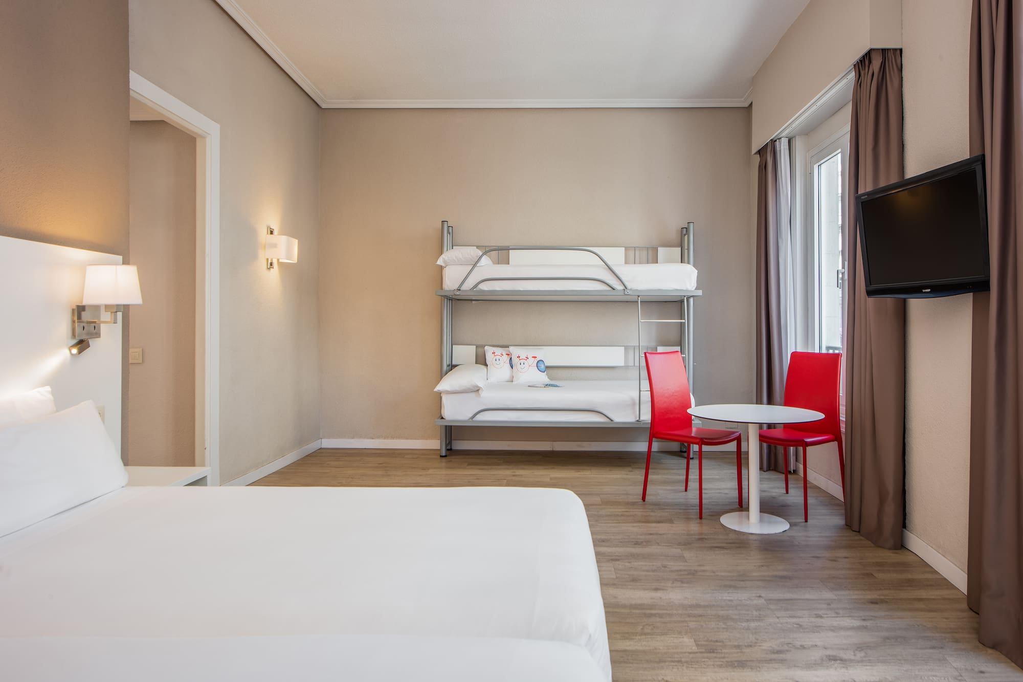 a room with a bunk bed and a table