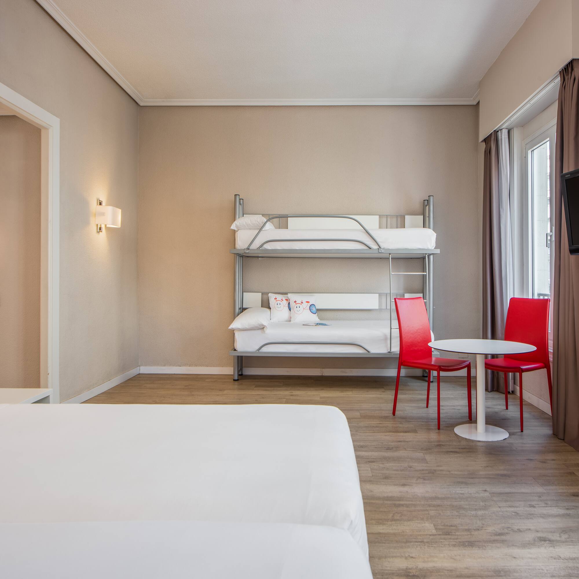 a room with a bunk bed and a table