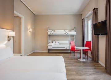 a room with a bunk bed and a table