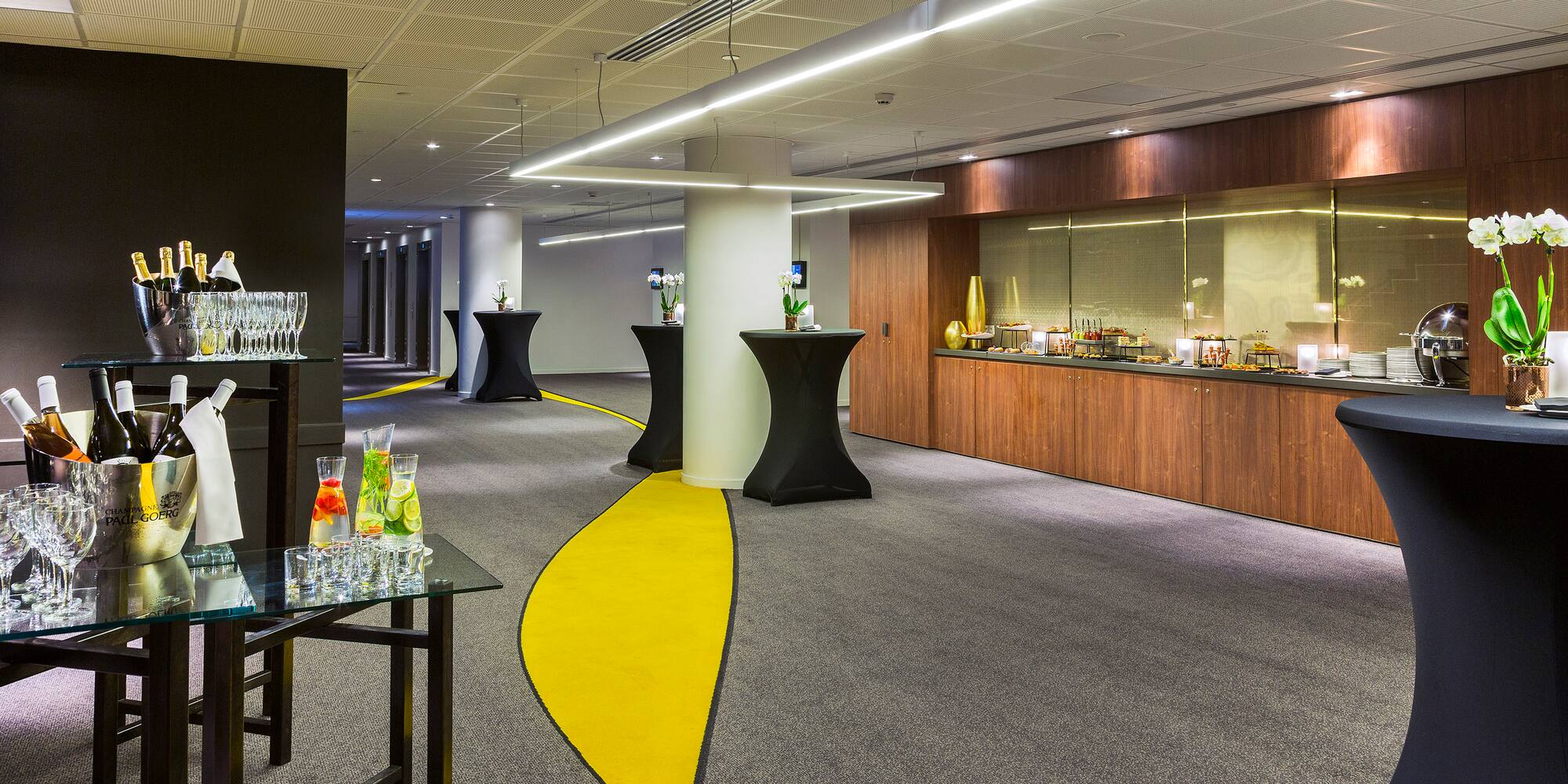 a room with a yellow and black carpet