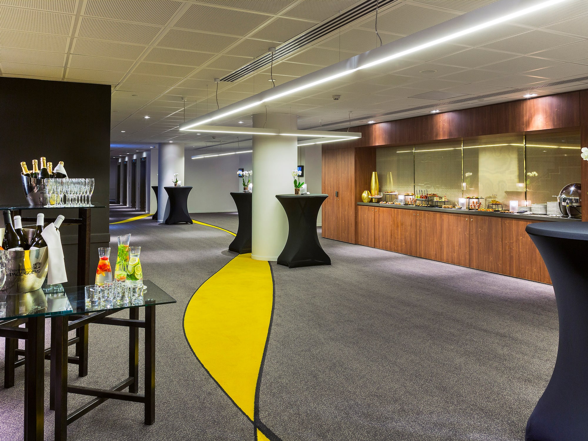 a room with a yellow and black carpet