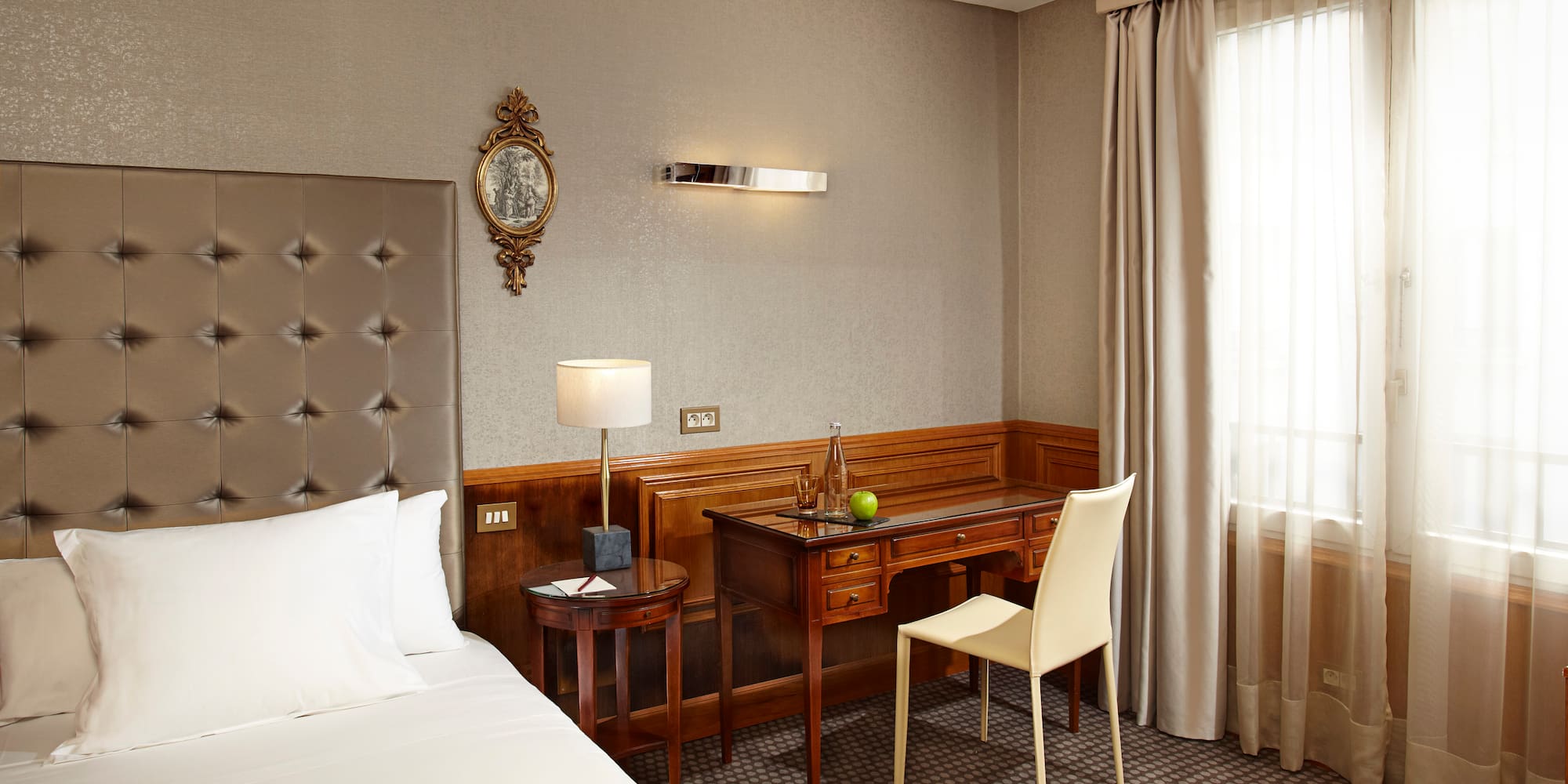 a room with a bed and a desk