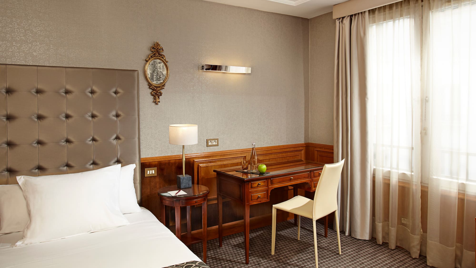 a room with a bed and a desk