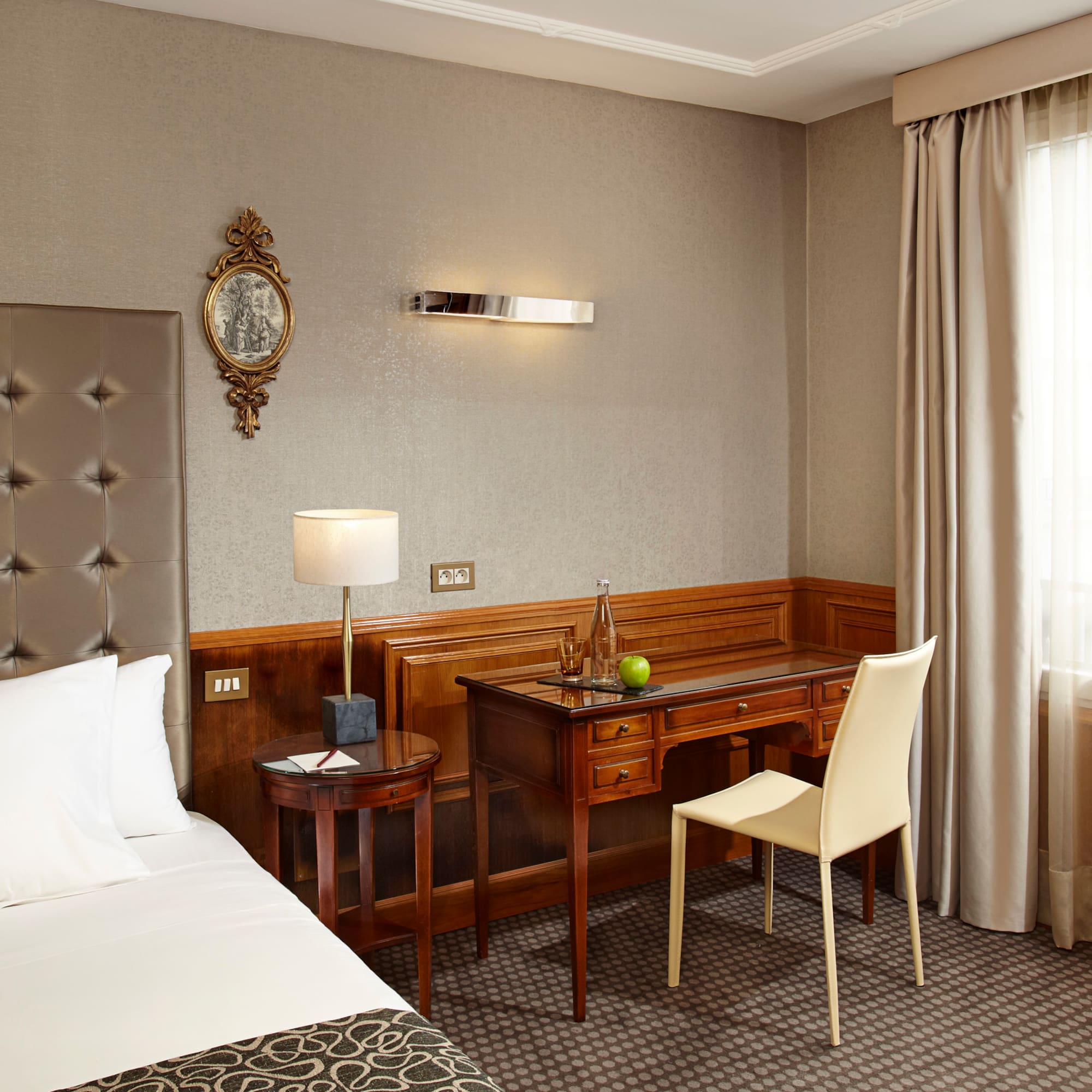 a room with a bed and a desk