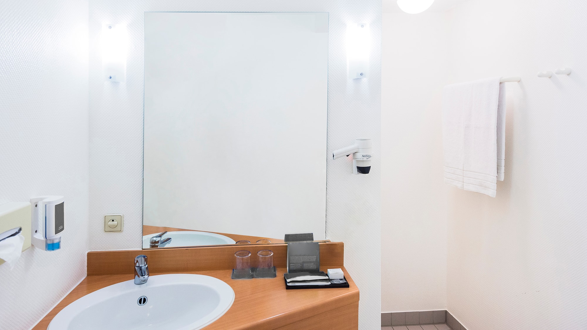 a bathroom with a mirror and sink