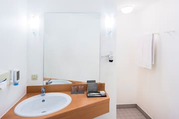 a bathroom with a mirror and sink
