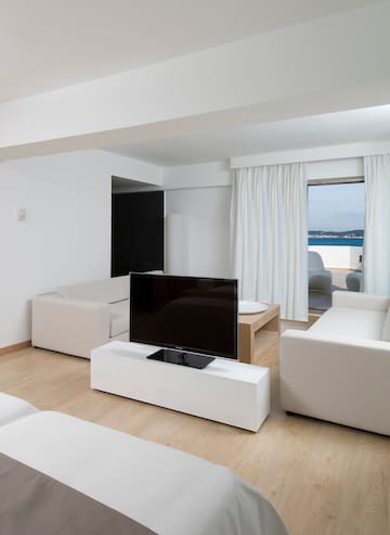 a living room with a television and couches