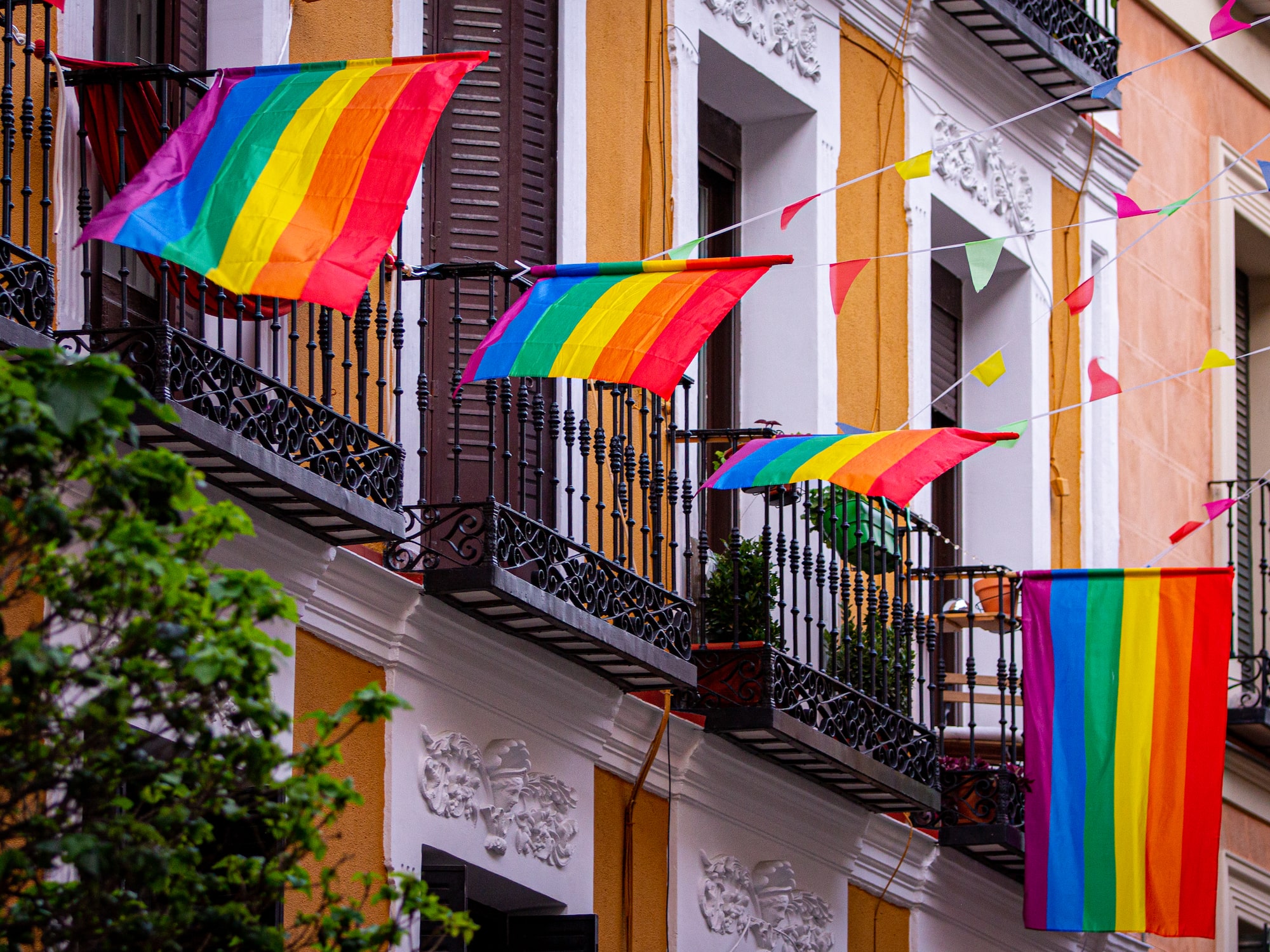 a rainbow flag on a balcony