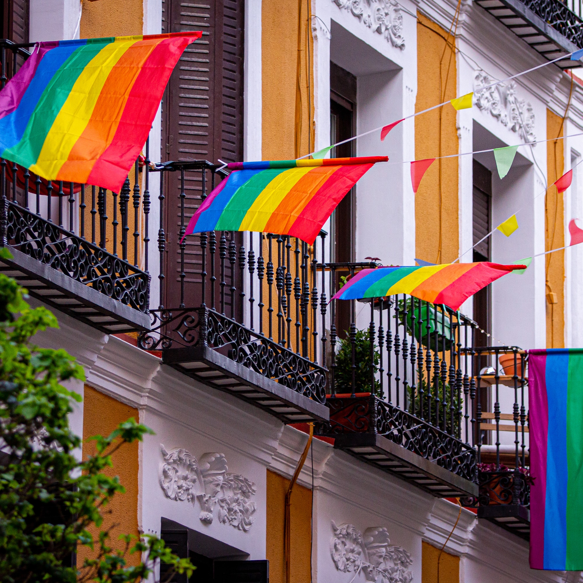 a rainbow flag on a balcony