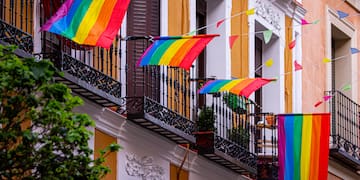 a rainbow flag on a balcony