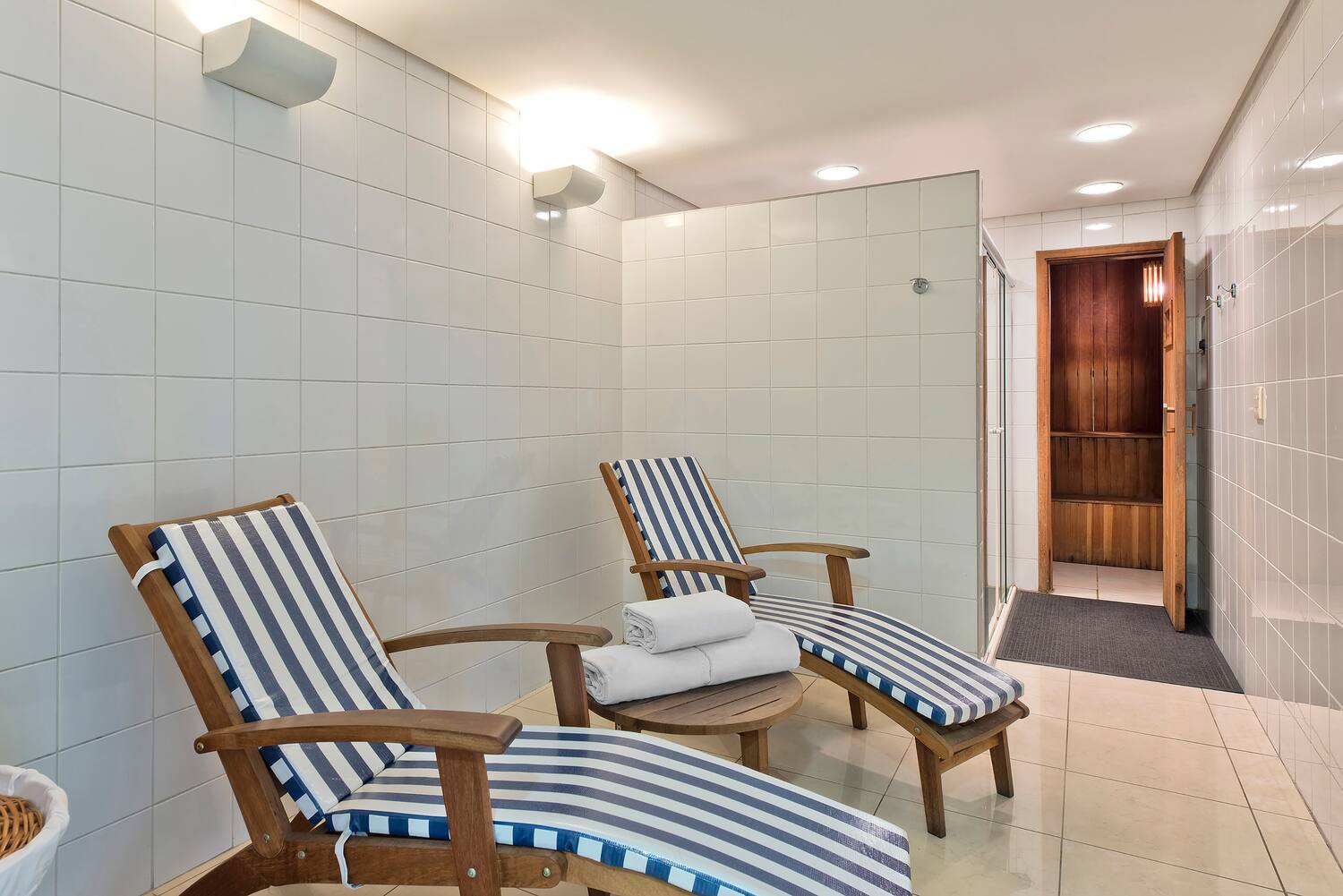 a room with chairs and a shower