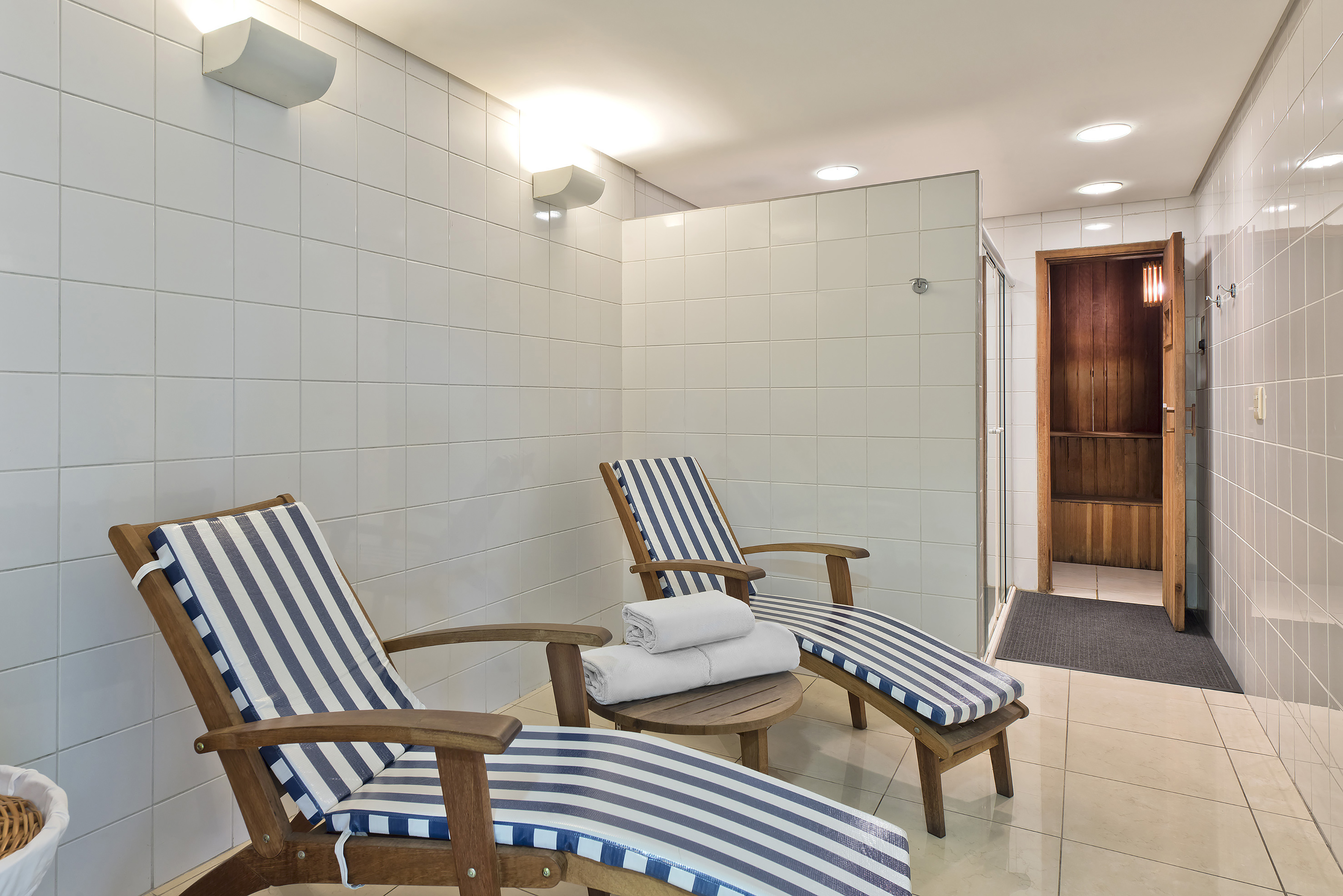 a room with chairs and a shower