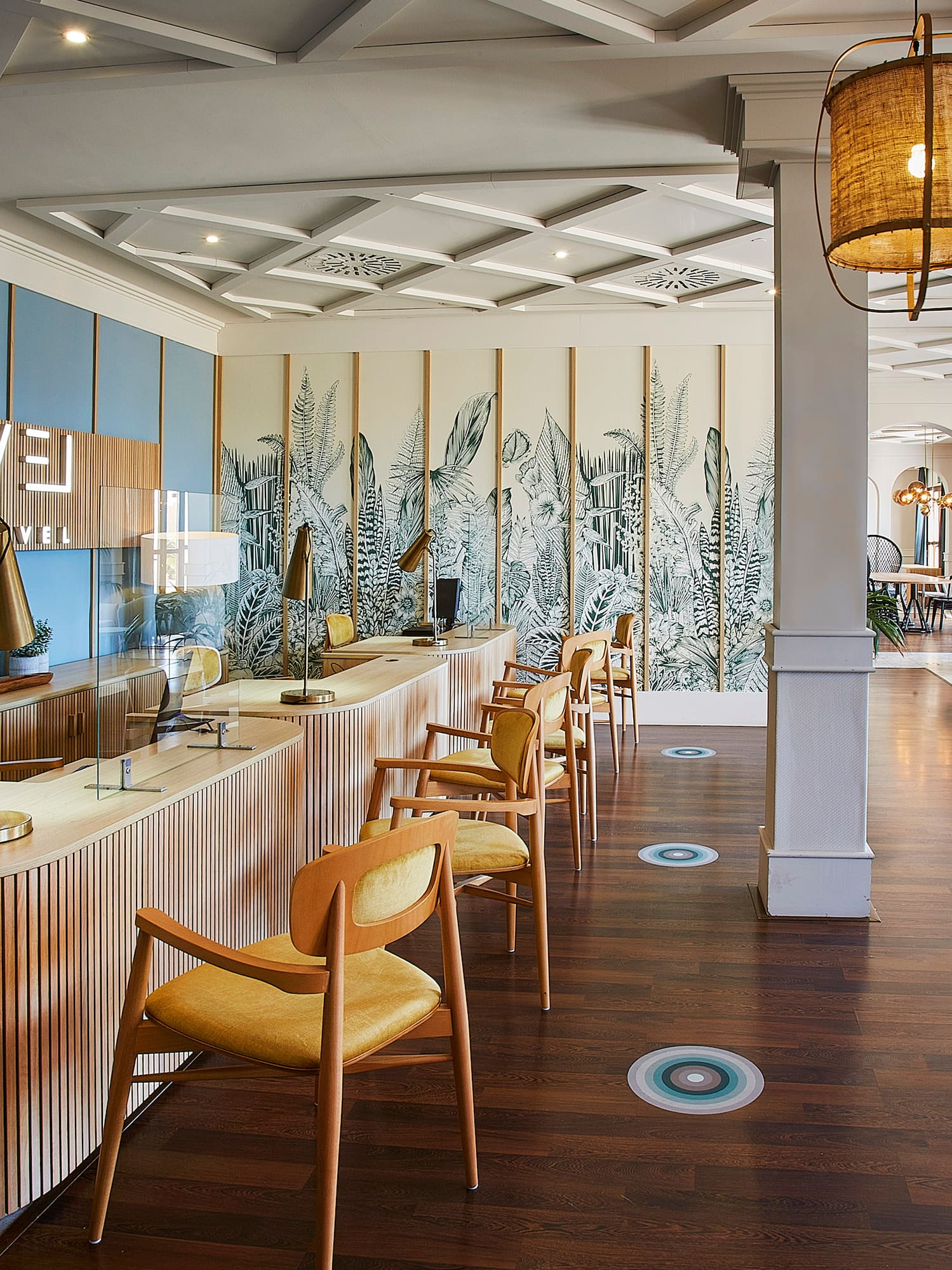 a room with a long counter and chairs