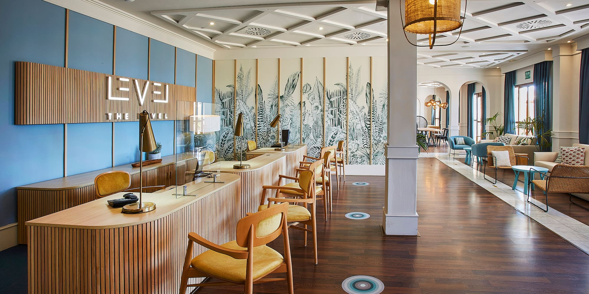 a room with a long counter and chairs