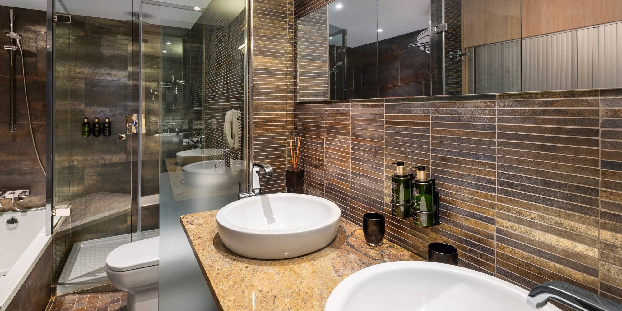 a bathroom with a shower and sink