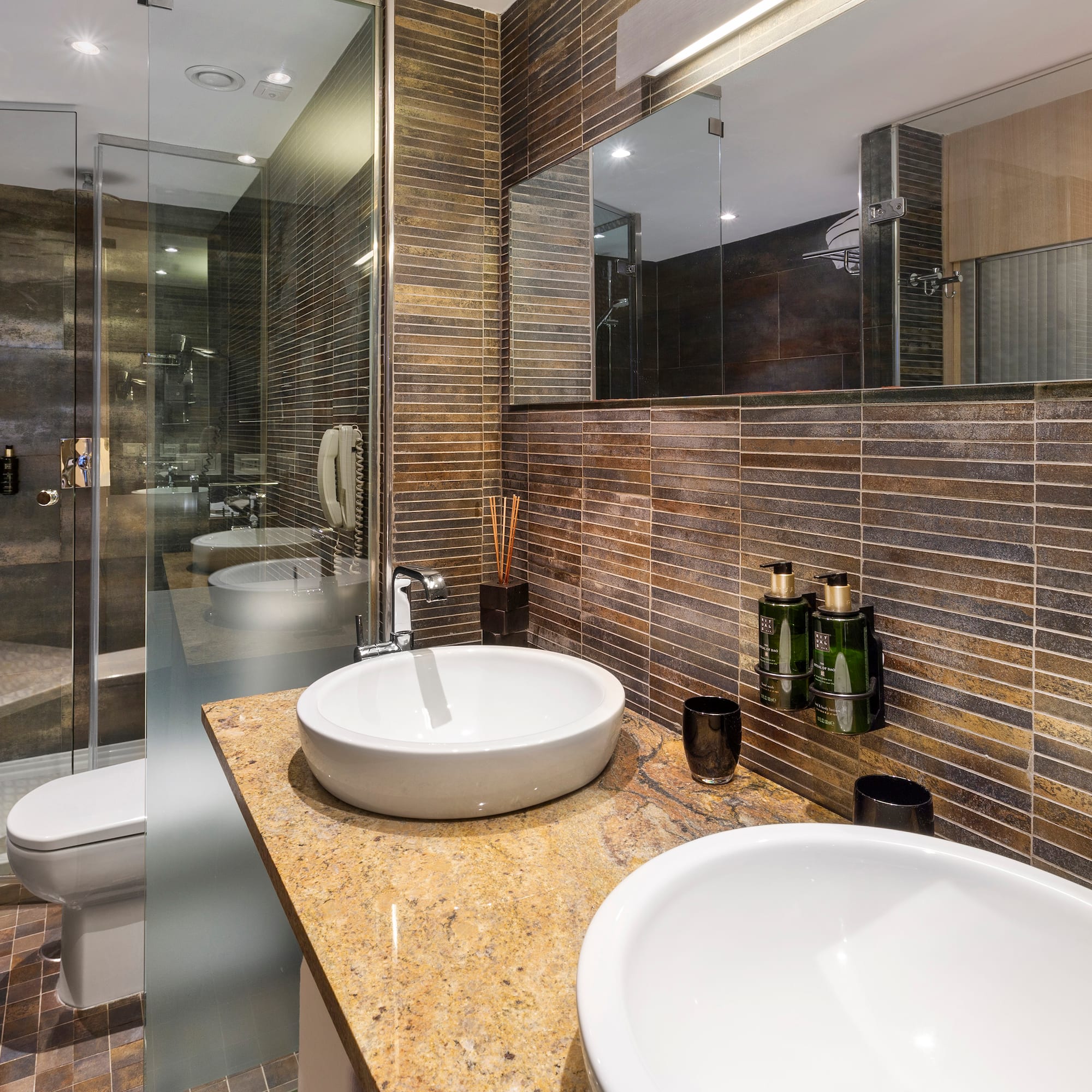 a bathroom with a shower and sink