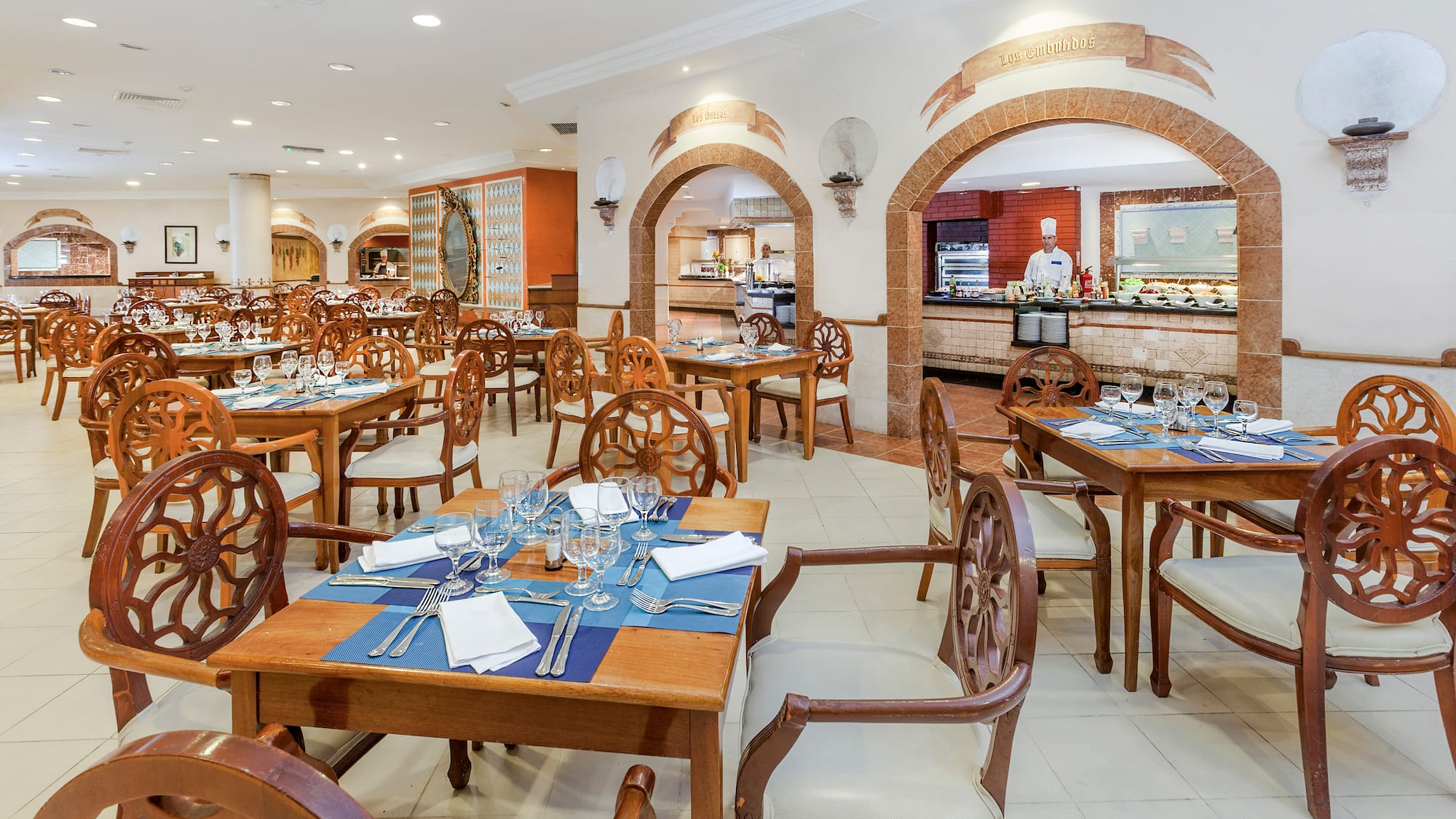 a restaurant with tables and chairs