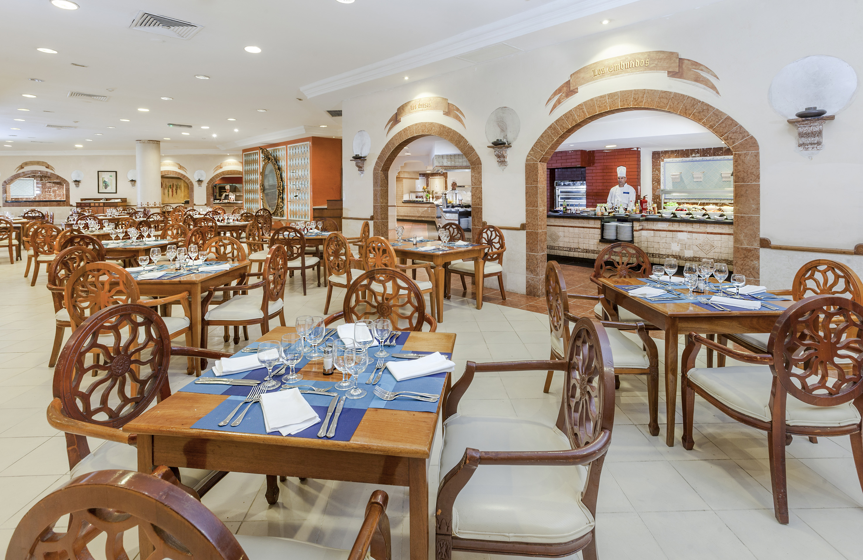 a restaurant with tables and chairs