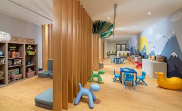 a room with wooden columns and toys
