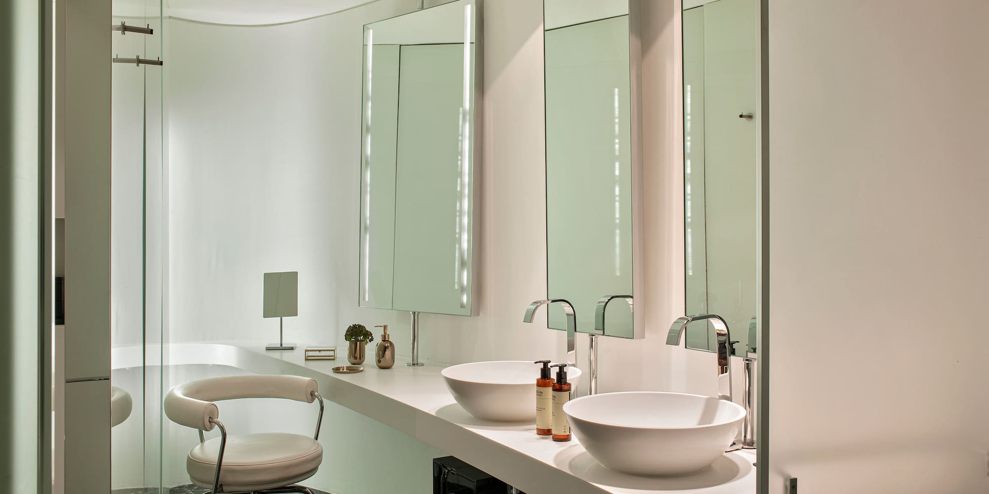 a bathroom with a sink and mirror