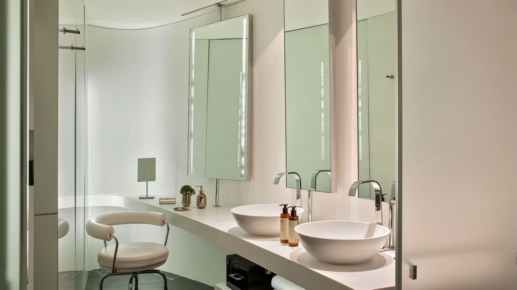 a bathroom with a sink and mirror