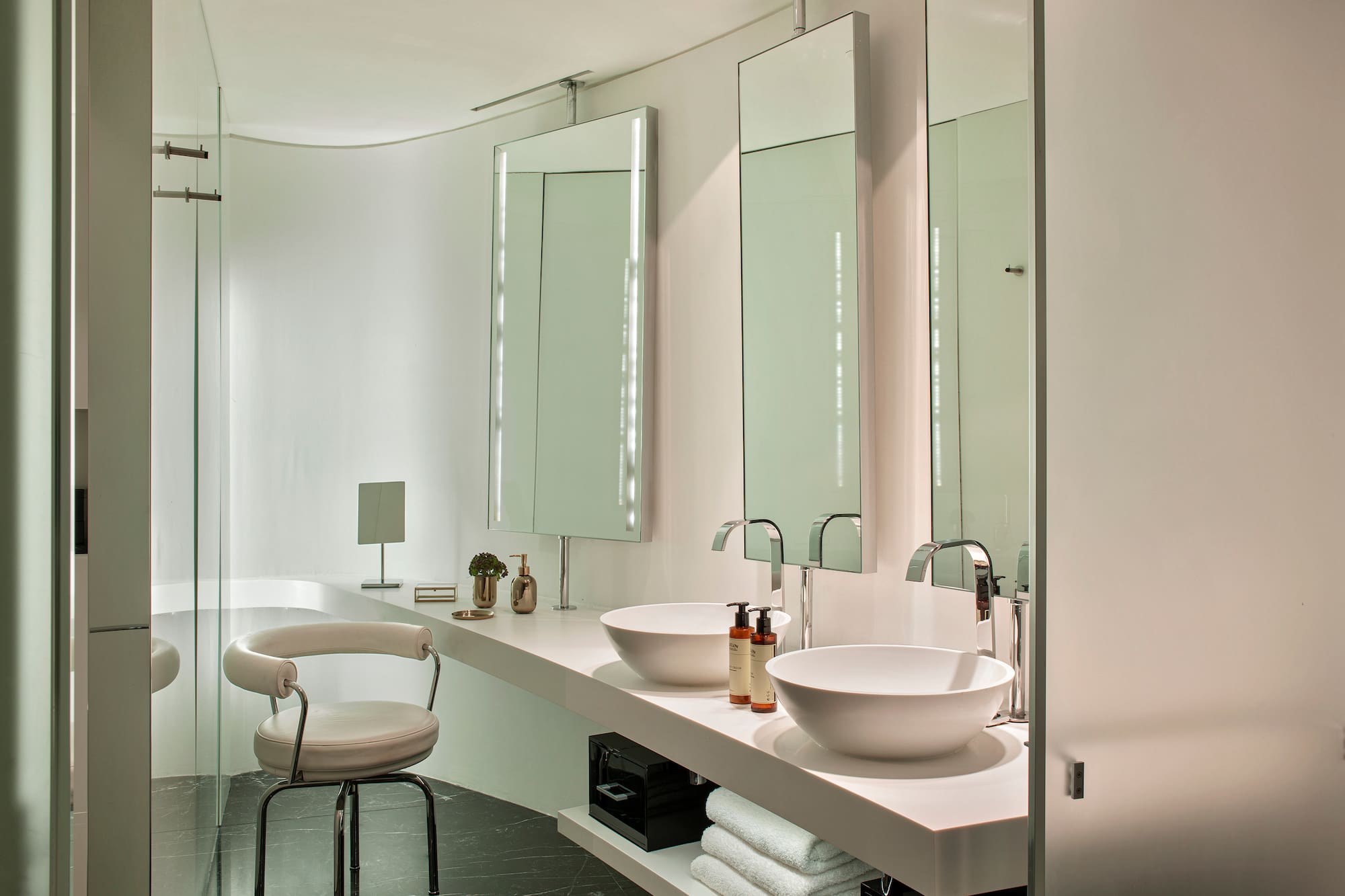 a bathroom with a sink and mirror
