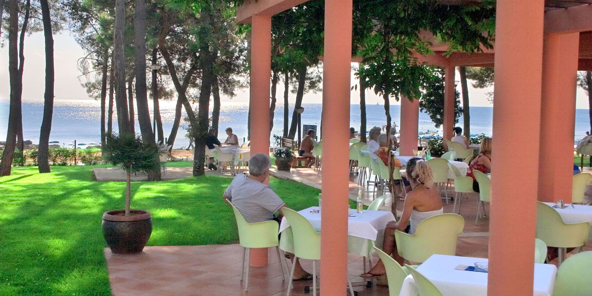 people sitting at tables outside