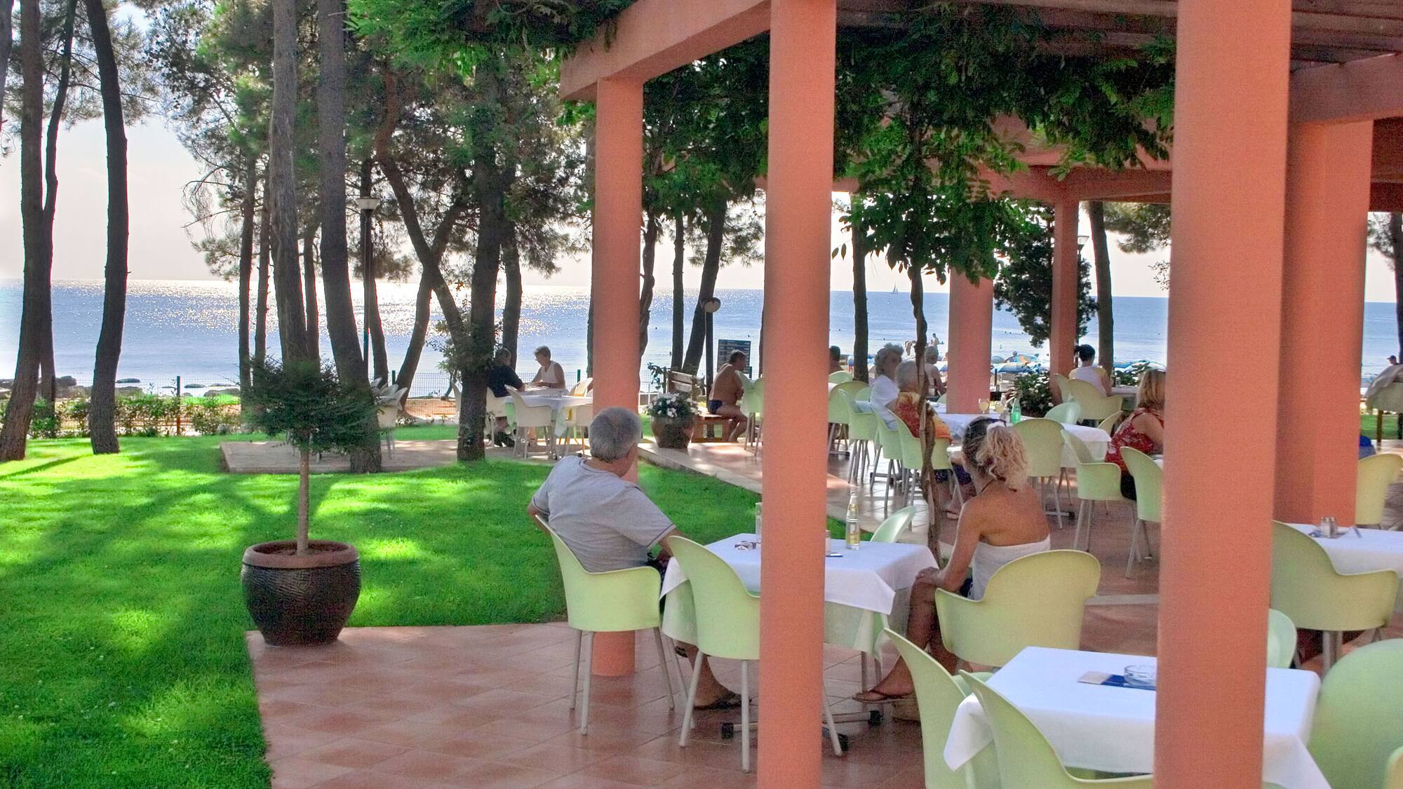 people sitting at tables outside