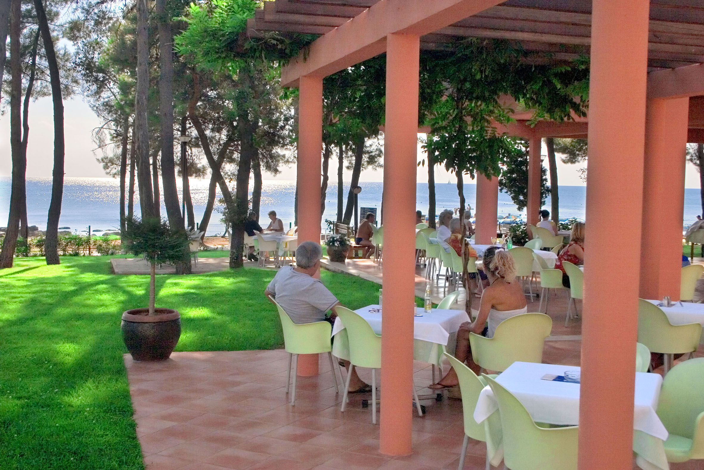 people sitting at tables outside