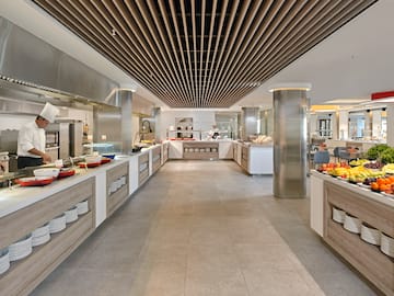 a large kitchen with food on the counter