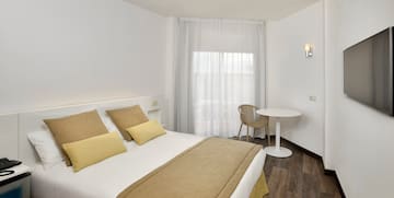 a room with a bed and a table