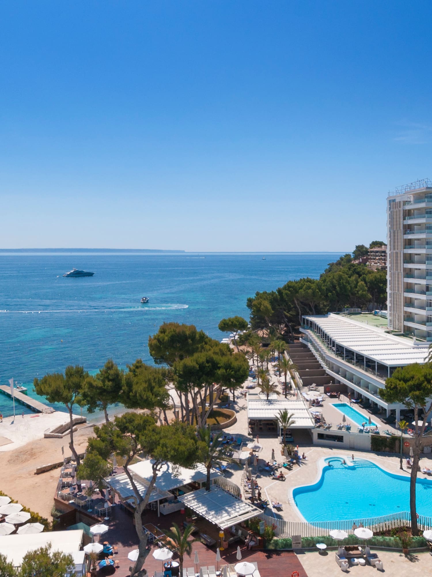 a resort with a pool and a beach
