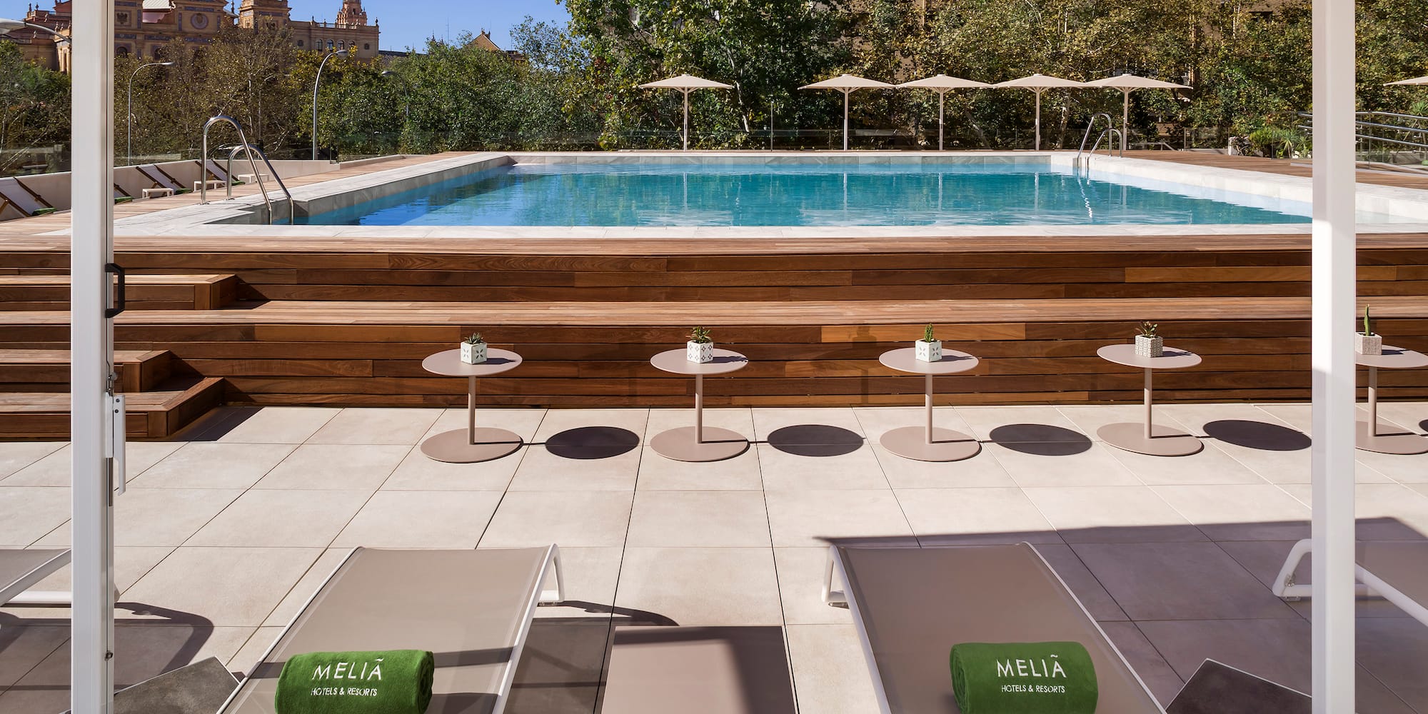a pool with chairs and tables