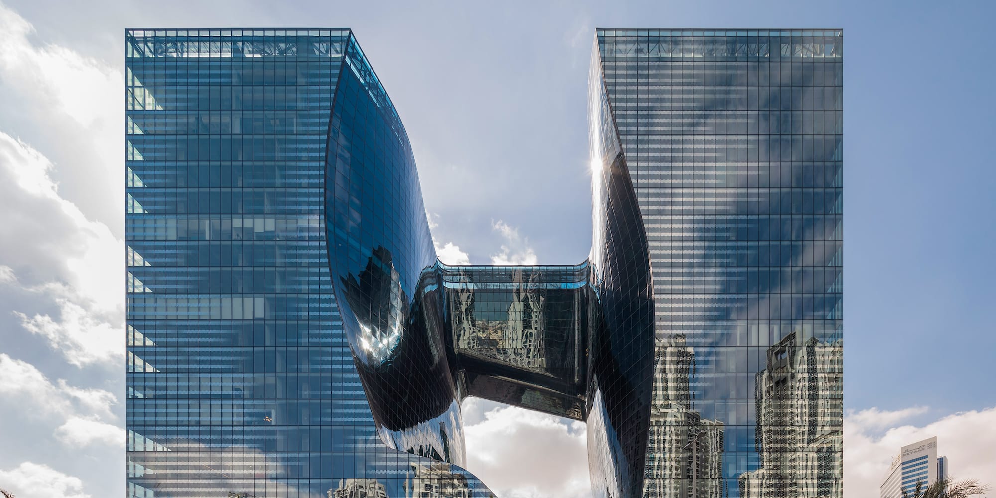a building with a curved glass facade