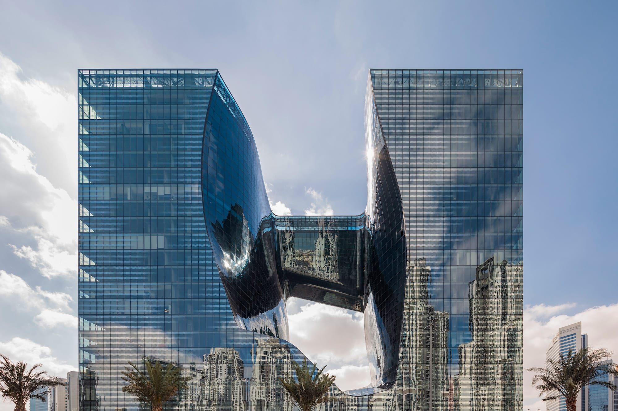 The Opus by Zaha Hadid: unique glass skyscraper in Dubai with a curved void.