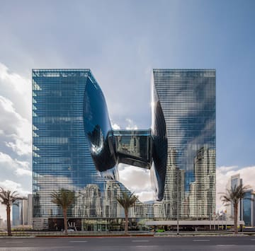 a building with a curved glass facade