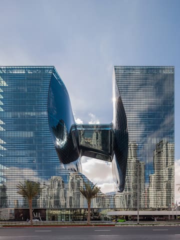 a building with a curved glass facade