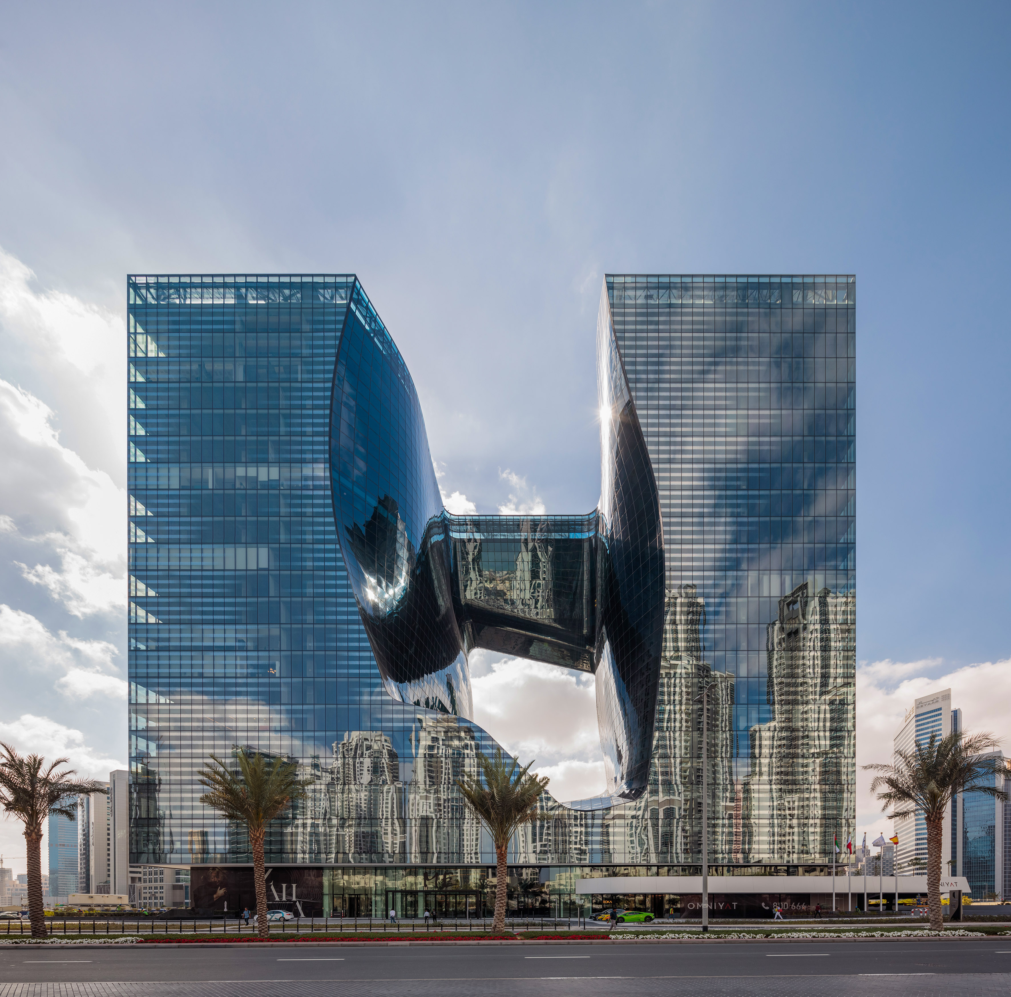 The Opus by Zaha Hadid: unique glass skyscraper in Dubai with a curved void.