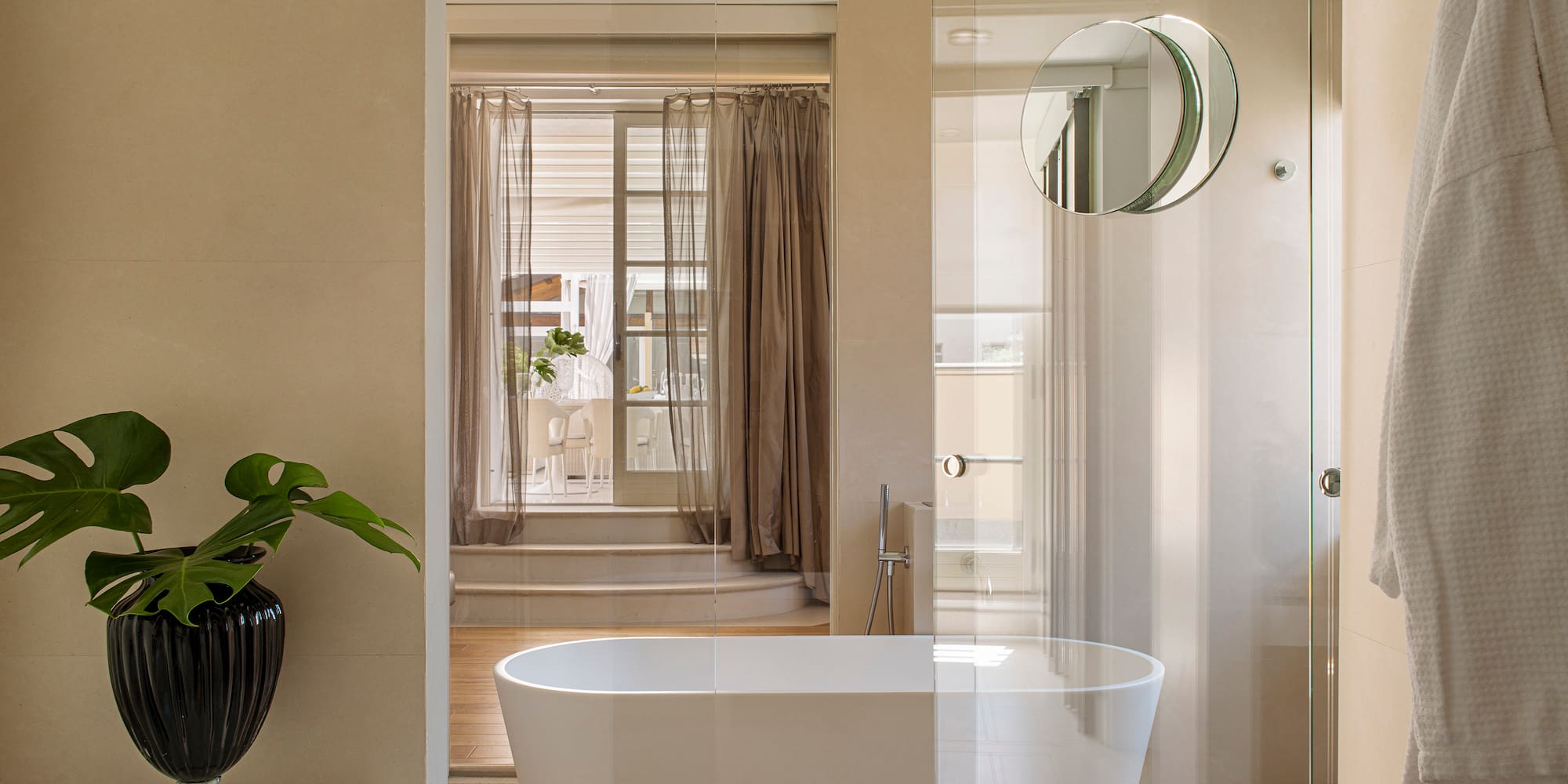 a bathroom with a tub and shower