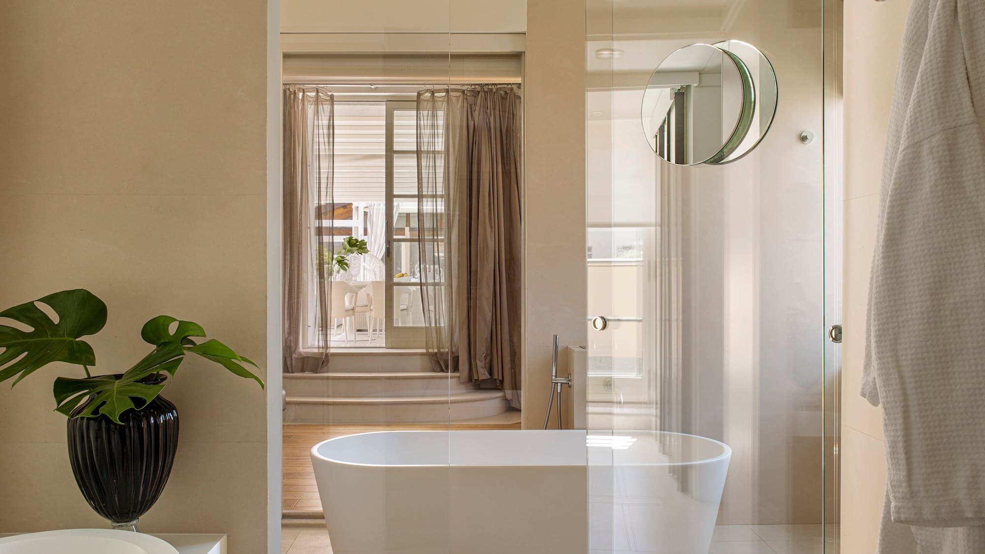 a bathroom with a tub and shower