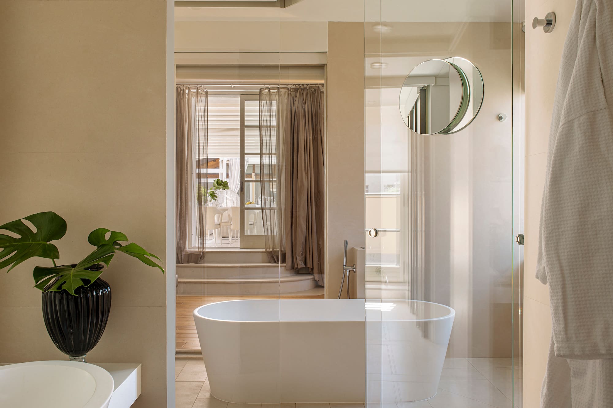 a bathroom with a tub and shower