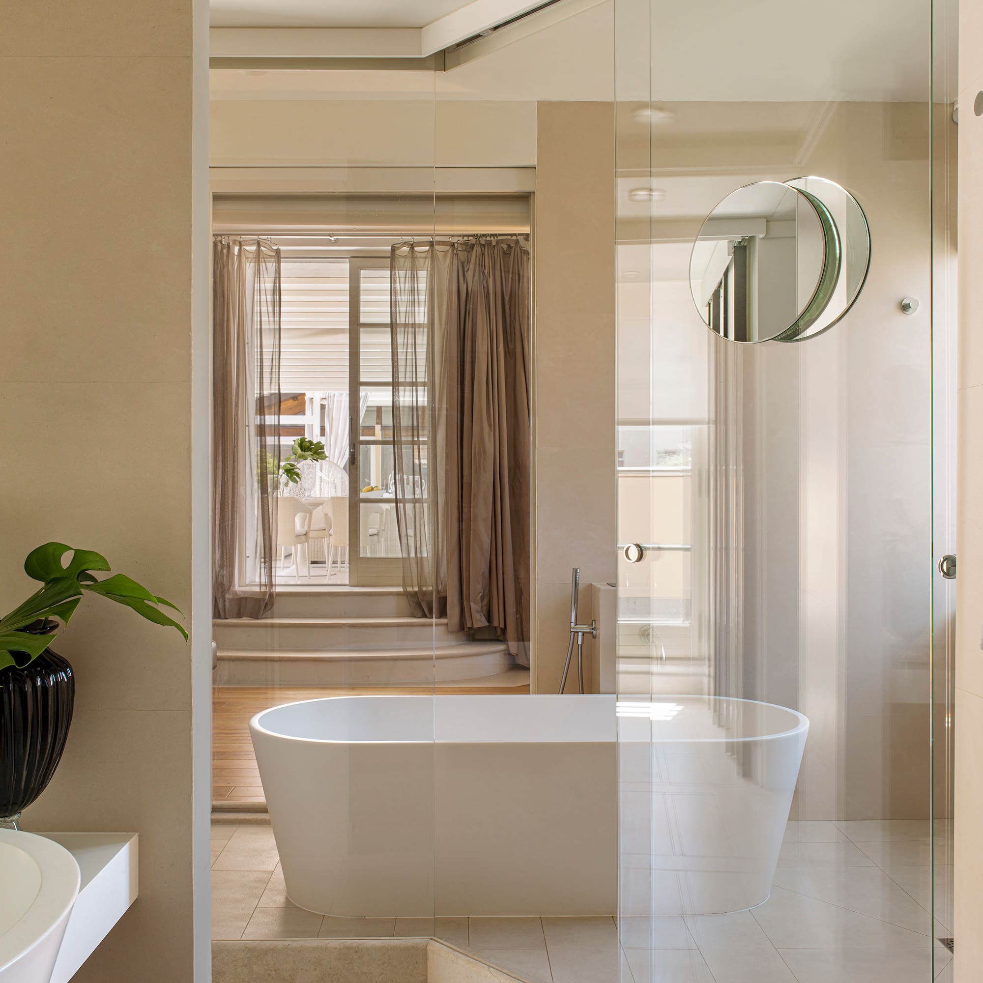 a bathroom with a tub and shower