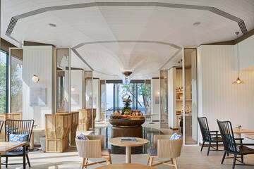 a room with a table and chairs