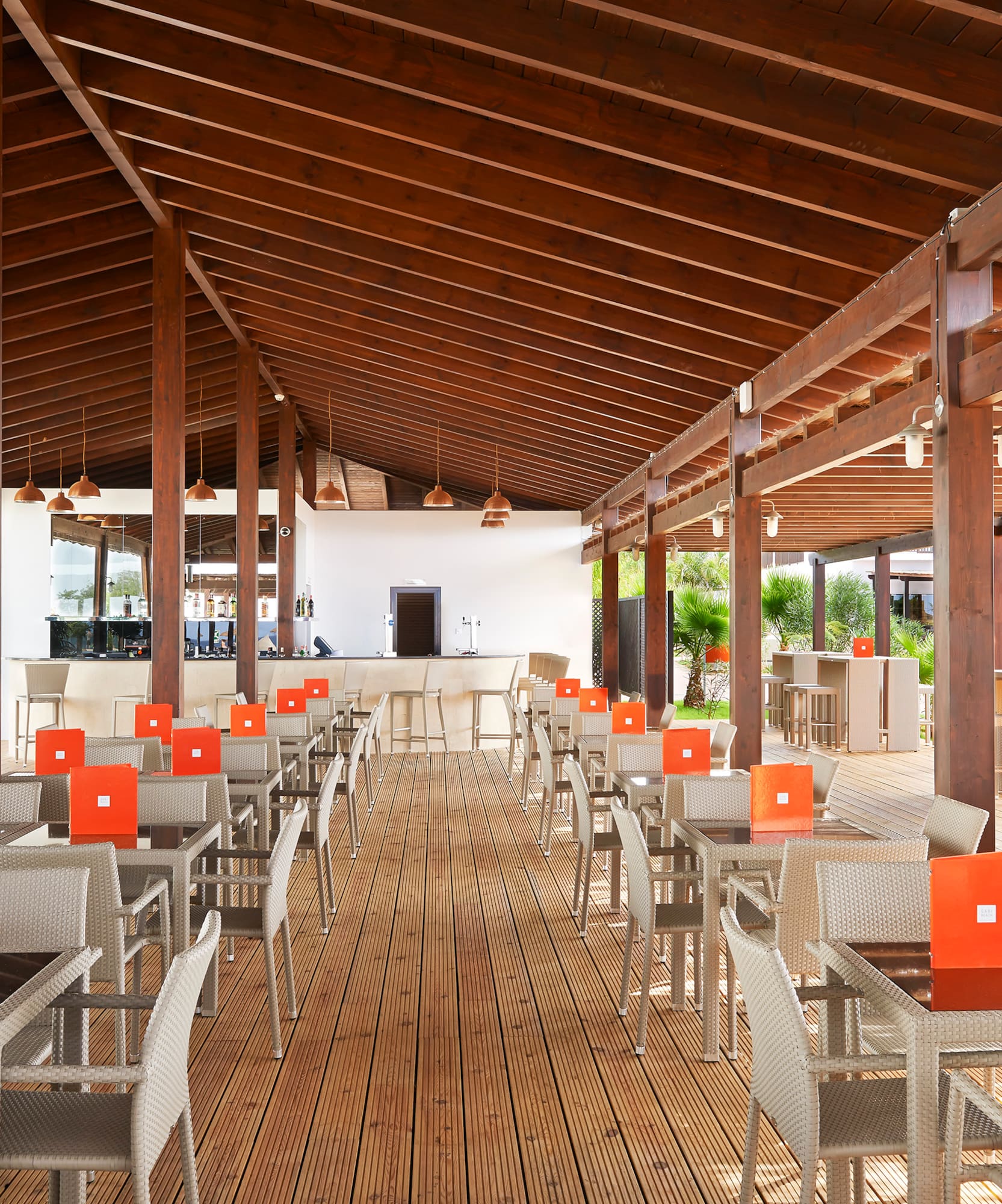 a patio with tables and chairs