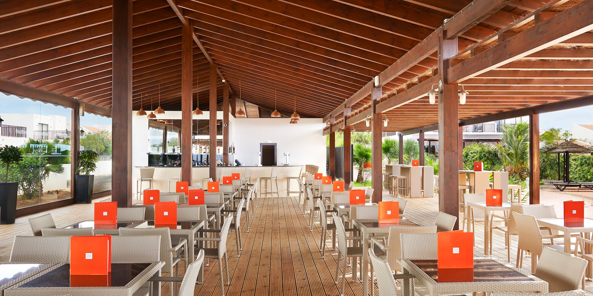 a patio with tables and chairs