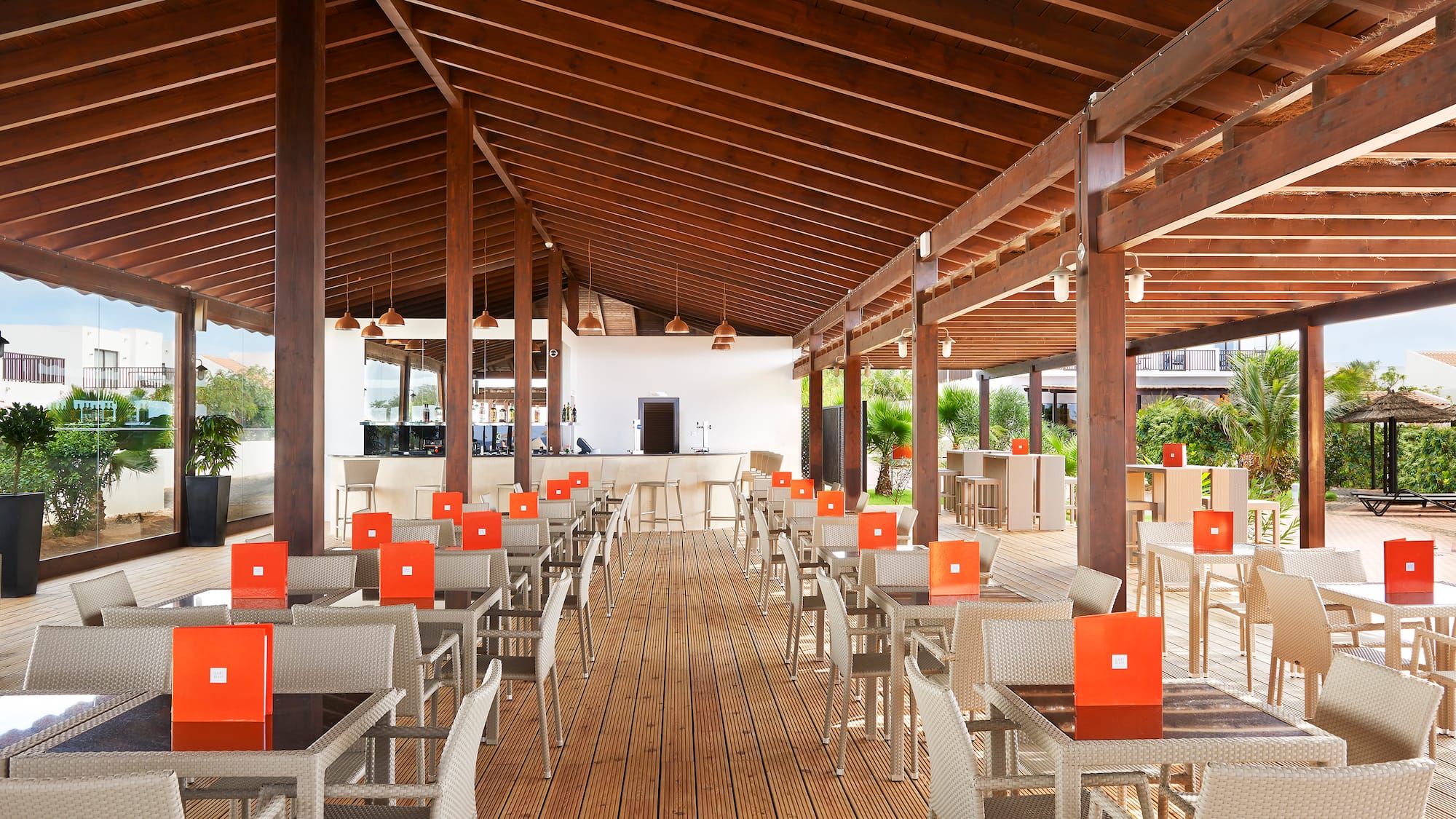 a patio with tables and chairs