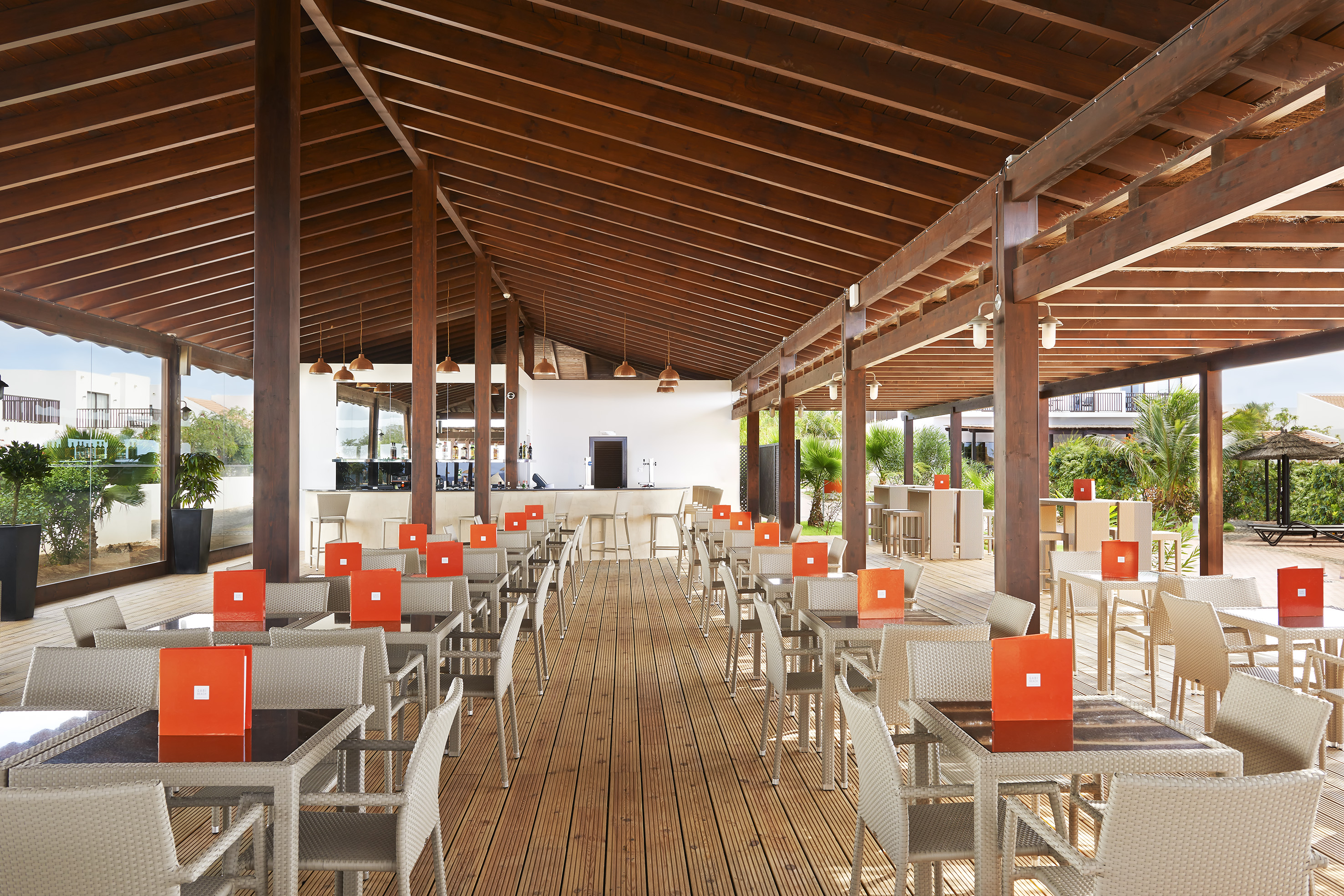 a patio with tables and chairs